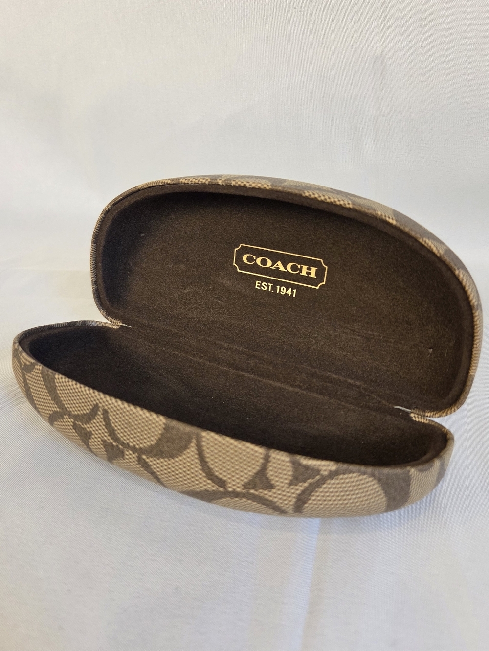 Classic Coach signature C design eyeglass/sunglasses case in brown and tan.